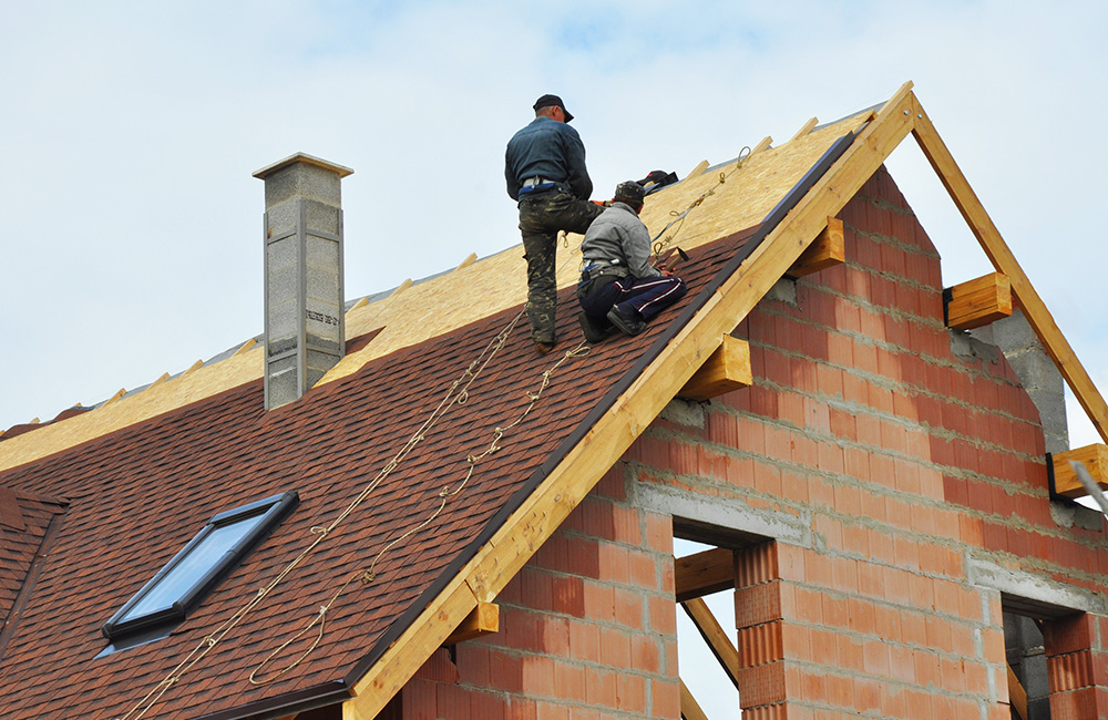 expert roofers performing roof repair on a residential roof in San Antonio