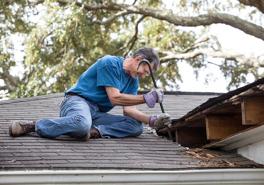 |Homeowners repairing his damaged residential roof